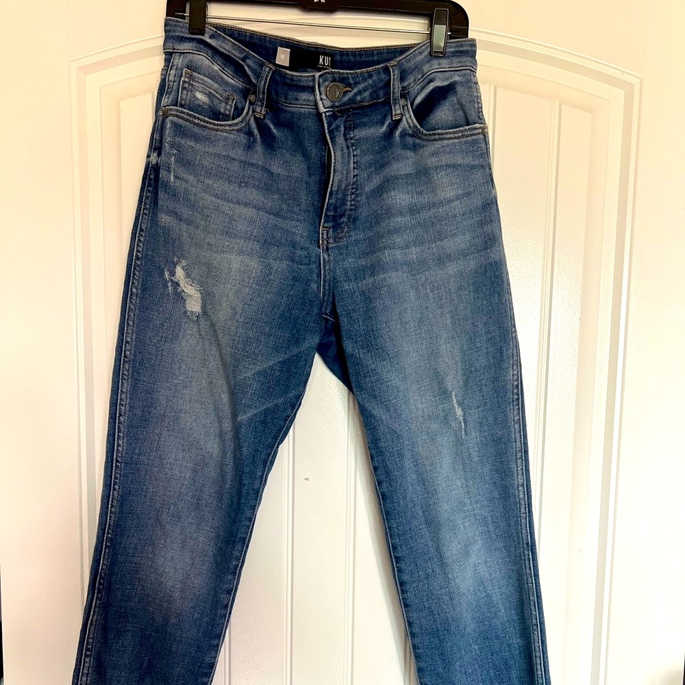 Distressed denim blue jean